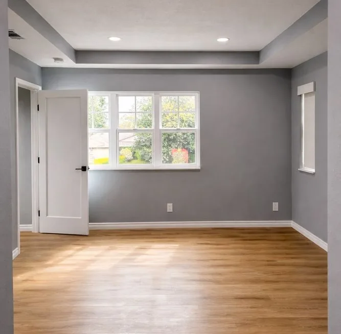 Finished open-concept living space with hardwood floors